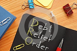 Debt relief order DRO is shown on the conceptual business photo