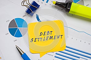 DEBT SETTLEMENT phrase on the sheet