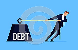 Debtor. Businessman is pulling a huge weight with a debt. photo
