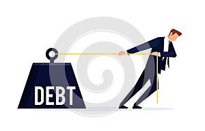 Debtor. Businessman is pulling a huge weight with a debt. photo