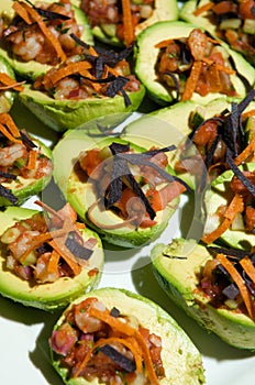 Decadent avocado halves topped with pico de gallo photo