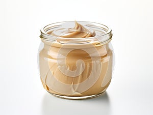 Decadently Delicious: Spotlight on Smooth Peanut Butter Isolated on White Background