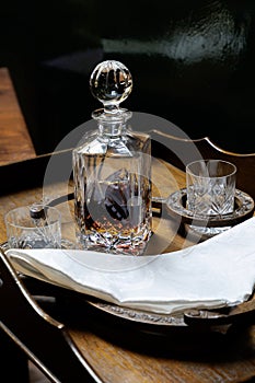 Decanter and glasses on occasional table