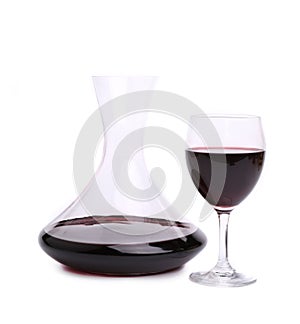 Decanter with red wine and glass