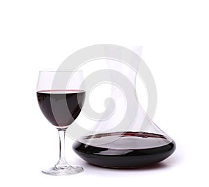 Decanter with red wine and glass