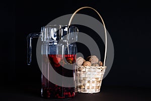 Decanter with strawberry juice in darkside