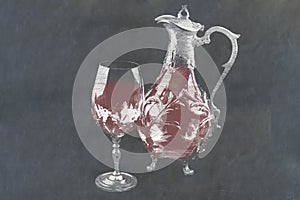 Decanter and wine glass with red wine on slate