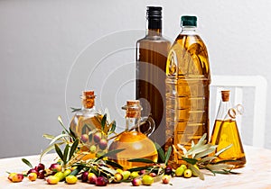 Decanters and bottles with olive oil photo