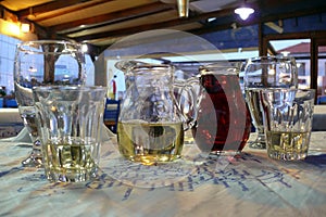 The decanters of wine and glasses, closeup.