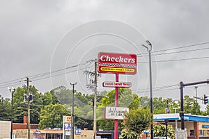 Checkers street sign and cloudy sky
