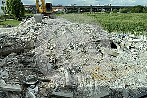 Decayed concrete from a collapsed building Lots of cement debris piled up on the floor.