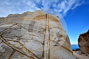 Decayed granite rock by seaside