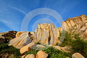 Decayed granite under blue sky