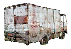 Decayed rusty nameless car van for transportation of agricultural products and bread thrown in the forest isolated