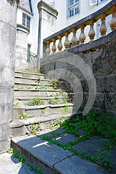 Decayed vintage stairs from outside in Pau, France. Abandoned French architecture. Vertical photo