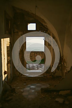 Decaying Beauty: Interior of Abandoned House with View of Stunning Mountain Region During Golden Hour in Old Town Craco