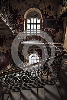 Decaying staircase in an abandoned house