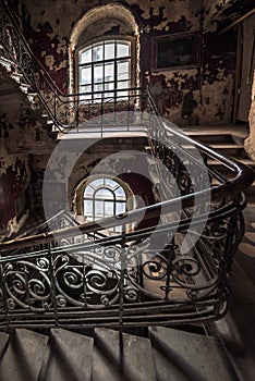 Decaying staircase in an abandoned house