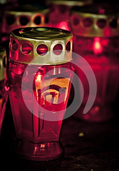 Deceased holiday. Candles on dark background.