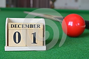 December 01, number cube on snooker table, sport background.