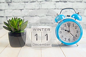 December 11 on the wooden calendar.The eleventh day of the winter month, a calendar for the workplace. Winter