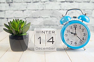 December 14 on the wooden calendar.The fourteenth day of the winter month, a calendar for the workplace. Winter