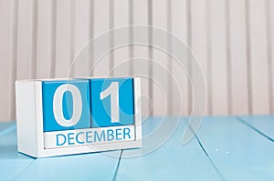 December 1st. Day 1 of month, calendar on wooden background. Winter time. Empty space for text