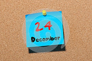 December 24th Eve Christmas. Day 24 of month, Calendar on cork notice board. New year time. Empty space for text