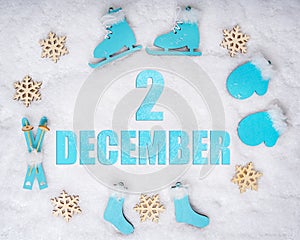 December 2nd. Sports set with blue wooden skates, skis, sledges and snowflakes and a calendar date. Day 2 of month.