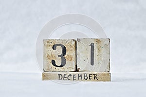December 31 New Years Eve calendar on white snowy background, copy space