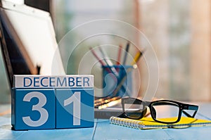 December 31st. Day 31 of month, calendar on workplace background. New year at work concept. Winter time. Empty space for