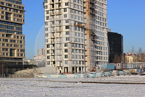 December 5, 2020 Moscow, Russia. Crane and building construction site against blue sky