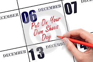 December 6th. Hand writing text Put On Your Own Shoes Day on calendar date. Save the date.