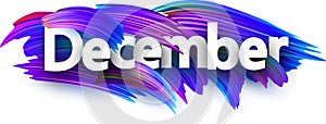 December banner with blue brush strokes.