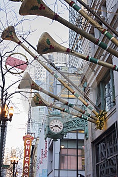 Macy`s Department Store outdoor Christmas trumpet decorations and famous clock