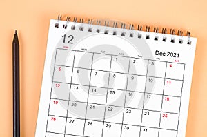 December 2021 desk calendar on beautiful background