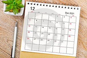 December 2021 desk calendar with pen