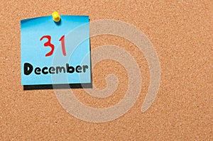 December 31st. Day 31 of month, Calendar on cork notice board. New year at work concept. Winter time. Empty space for