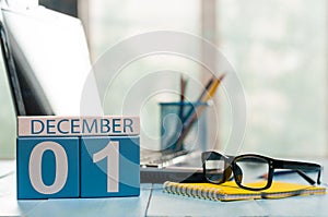 December 1st. Day 1 of month, calendar on teacher workplace background. Winter time. Empty space for text photo