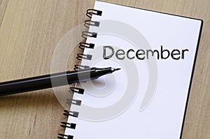 December text concept on notebook photo