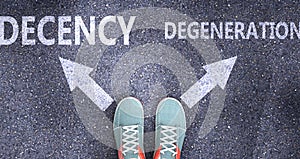 Decency and degeneration as different choices in life - pictured as words Decency, degeneration on a road to symbolize making