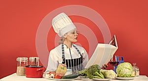 Decent diet is best diet. cooking concept. Working in a Modern Kitchen. woman chef read cookbook. Can be used for