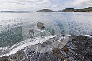 Deception Island ocean view from above at Deception Pass State Park at Whidbey Island Washington during summer