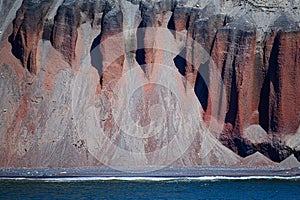 Deception Island, South Shetland Islands, Antarctica, part of orange craggy cliffs of Whalers