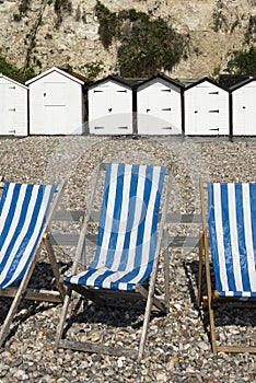 Dech Chairs and Beach Huts at Beer, Devon, UK.