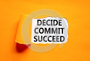 Decide commit succeed symbol. Concept word Decide Commit Succeed on beautiful white paper. Beautiful orange table orange