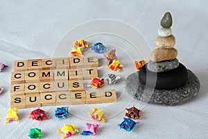 Decide Commmit Focus Succeed with wooden alphabets.