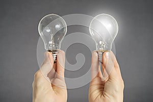 Decision making concept, hands with light bulbs