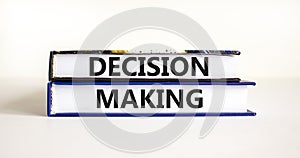 Decision making symbol. Concept words Decision making on books. Beautiful white table white background. Business and decision