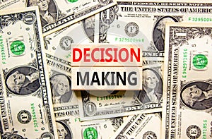 Decision making symbol. Concept words Decision making on wooden blocks. Beautiful background from dollar bills. Business and